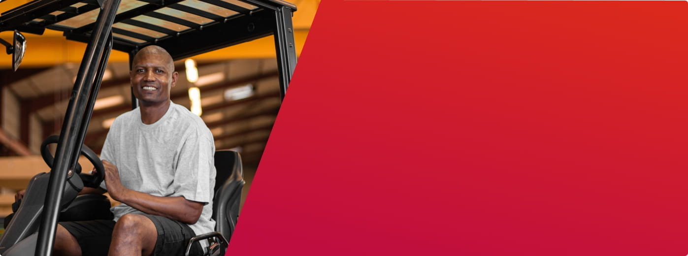 Worker on a forklift in a warehouse